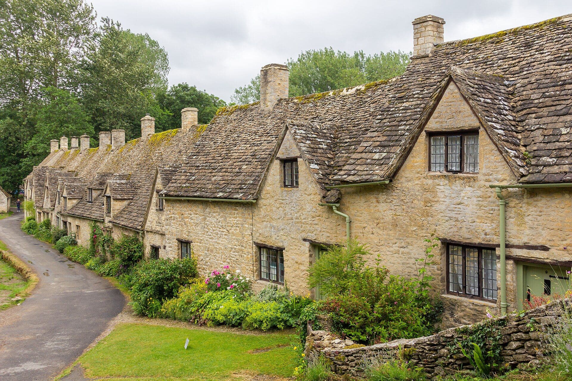 Arlington Row, a terrace of honey-stone cottages in Bibury, Cotswolds